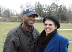 Demetrius Folsom and Peggy O’Connor-Campbell flash smiles in recalling the success that the fifth- and sixth-grade football team of the Mother Theodore Catholic Academies in Indianapolis had during the 2012 season of the Catholic Youth Organization. O’Connor-Campbell taught Folsom in grade school and asked him to coach the team. (Photo by John Shaughnessy)