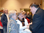 Archbishop Tobin greeting people at Mass