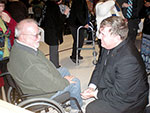 Archbishop Tobin greeting a man