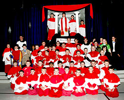 Students at St. Mary School in North Vernon pose on March 11 in their school’s gym after completing a mock conclave in which students acted out various roles and, in the process, learned how popes are elected. Eighth-grader Bret Sawyer, center at the top, was elected pope on the second ballot and took the name Maximilian. (Submitted photo) 