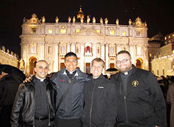 Seminarian Matthew Tucci, left, transitional Deacon Martin Rodriguez, seminarian Anthony Hollowell and transitional Deacon Douglas Marcotte pose on March 12 in St. Peter’s Square at the Vatican. It was the first day of the conclave that elected Cardinal Jorge Mario Bergoglio of Buenos Aires as pope. The seminarians, who are receiving their priestly formation at the Pontifical North American College in Rome, were in the square the next night to see Pope Francis introduced. (Submitted photo)
