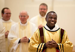 Deacon John Kamwendo smiles after being ordained a transitional deacon by Bishop Christopher J. Coyne at the Archabbey Church of Our Lady of Einsiedeln in St. Meinrad on April 14, 2012. He will be ordained a priest at SS. Peter and Paul Cathedral in Indianapolis on May 18. (Photo courtesy of Saint Meinrad Archabbey)