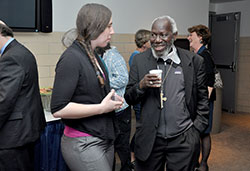 Marian University student and global studies minor Kelly Hoehn speaks with Bishop Paride Taban of South Sudan at a reception following the retired bishop’s lecture as part of Marian University’s Richard G. Lugar Franciscan Center for Global Studies Speaker Series at Marian University in Indianapolis on April 17. (Photo by Natalie Hoefer)