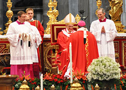 Pope Francis greets Archbishop Joseph W. Tobin of Indianapolis after presenting him with a pallium during Mass marking the feast of Sts. Peter and Paul in St. Peter’s Basilica at the Vatican on June 29. The pope presented woolen palliums to 34 archbishops during the liturgy. (Photo by John Shaughnessy)