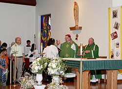 Archbishop Joseph W. Tobin and Father Larry Crawford concelebrate a Mass marking the 50th anniversary of St. Gabriel the Archangel Parish on the west side of Indianapolis on June 23. (Submitted photo by Patrick Dimmick)