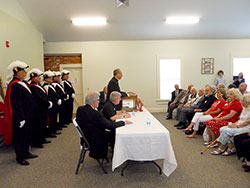Archbishop William E. Lori of Baltimore speaks during the July 17 ceremony for the opening of the museum room in the Cardinal Ritter House in New Albany. Standing behind Archbishop Lori is an honor guard from the Cardinal Ritter Council #1221 Knights of Columbus in New Albany. (Photo by Patricia Cornwell)