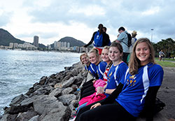Meghan Bender, left, Lauren Klosterman, Morgan Klosterman, Julie Doran and Chelsea Walker relax by the sea during World Youth Day on July 26. (Submitted photo)