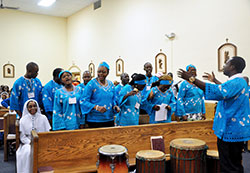 Members of the Congolese Catholic Choir in the U.S. sing a song of praise during the Mass held at St. Bernadette Church in Indianapolis during the third annual convention of the National Association of African Catholics in the U.S. on Sept. 7. (Photo by Natalie Hoefer)