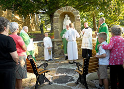Archbishop Joseph W. Tobin proclaims a prayer at the rededication of the newly completed Marian grotto at St. Augustine Parish in Perry County on Sept. 7.	(Photo by Patricia Happel Cornwell) 