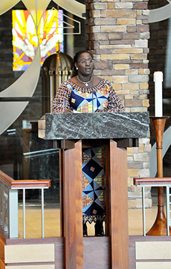 Brenda Kpotufe, originally from the French-speaking country of Togo in West Africa, proclaims the first reading at the Mass celebrated in French at St. Malachy Church in Brownsburg on Sept. 8. (Photo by Natalie Hoefer)