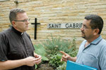 Priest and immigrant talking