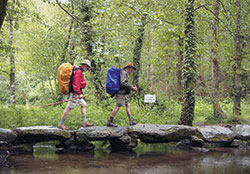 Two pilgrims profiled in Walking the Camino: Six Ways to Santiago walk across a stone bridge on an ancient pilgrimage path in northern Spain. The documentary will make its Midwest premiere later this month as a part of the Heartland Film Festival in Indianapolis. (Photo courtesy of Future Educational Films)