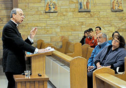 Archbishop William E. Lori of Baltimore gives a presentation on Nov. 29 at Our Lady of Perpetual Help Church in New Albany on the relationship of religious liberty and the Church’s ministry of charity. Archbishop Lori grew up in the New Albany Deanery faith community. (Photo by Sean Gallagher)