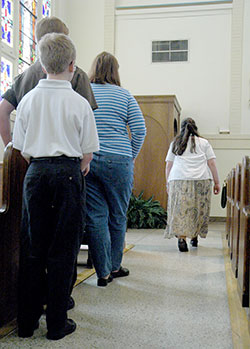 In this file photo, people stand in line to go to confession at Our Lady of the Most Holy Rosary Church in Indianapolis. From 6:30 p.m. to 8 pm. on April 2, priests will be available in churches across central and southern Indiana to celebrate the sacrament of penance with anyone who wishes to celebrate the sacrament and receive God’s mercy and forgiveness. (File photo by Sean Gallagher)