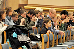 Students and teachers of Lumen Christi Catholic School in Indianapolis kneel in prayer during the Jan. 22 Mass at SS. Peter and Paul Cathedral that commemorated the 41st anniversary of the Roe v. Wade and Doe v. Bolton U.S. Supreme Court decisions that legalized abortion across the country. The Church in the U.S. now observes the date as the Day of Prayer for the Legal Protection of Unborn Children. The archdiocesan Office of Pro-Life and Family Life coordinates the Mass and local March for Life that follows the liturgy. (File photo by Sean Gallagher)