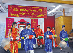 Children in traditional Vietnamese attire perform a traditional drum dance during the Feb. 2 reception held after the Vietnamese Mass celebrating the Lunar New Year. The archdiocese will host its first Intercultural Awards Dinner on Nov. 15 at the Archbishop Edward T. O’Meara Catholic Center in Indianapolis. (Criterion file photo by Natalie Hoefer)