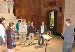Andrew Motyka, archdiocesan director of liturgical music and cathedral music, leads members of the archdiocesan Youth Honors Choir during practice on March 25 at SS. Peter and Paul Cathedral in Indianapolis. The youths will perform at the Holy Thursday Mass on April 17 at the cathedral. (Photo by Mike Krokos)