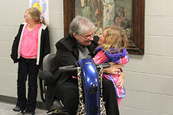 Sister Mary Emma Jochum, a Sister of St. Benedict of Ferdinand, hugs a student after a recent Wednesday night religion class at St. Paul Parish in Tell City. (Submitted photo)