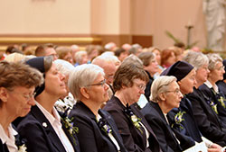 Daughters of Charity sisters of the St. Louise Province in St. Louis, Mo., to which the sisters in Indiana belong, listen to Archbishop Joseph W. Tobin’s homily at the farewell Mass in SS. Peter and Paul Cathedral in Indianapolis on April 28. The Daughters of Charity, which have operated the St. Vincent Health network of hospitals in Indiana for 133 years, are leaving the Archdiocese of Indianapolis and the Diocese of Lafayette. (Photo by Natalie Hoefer)