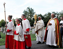 Deacon Robert Decker carries the Blessed Sacrament during a rosary procession for the Feast of the Assumption at the former St. Mary-of-the-Rock Parish in Franklin County on Aug. 15, 2013. (File photo by Natalie Hoefer)