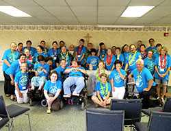 The SPRED retreat participants, catechists and helpers pose after the Mass that was held during the “Hallelujah Luau” retreat held at the Benedict Inn Retreat and Conference Center in Beech Grove on Aug. 2-3. (Submitted photo by Erin Jeffries)