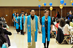 Eric Romero and his wife, Ana DeGante, members of St. Ambrose Parish in Seymour, process in with their classmates at a banquet celebrating the first graduating class of the archdiocesan Office of Intercultural Ministry’s Hispanic Leadership Institute on May 11, 2013, at the Archbishop Edward T. O’Meara Catholic Center in Indianapolis. The institute is one of three ethnic pastoral and catechetical formation programs operated by the archdiocesan Office of Intercultural Ministry. (Criterion file photo)
