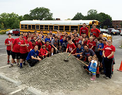 The student-athletes on the freshman football team of Roncalli High School in Indianapolis pose for a group photo on Aug. 16, the day they helped to build a prayer walk and a trail at the Benedict Inn  Retreat and Conference Center in Beech Grove. (Submitted photo)