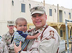 Soldier and young child