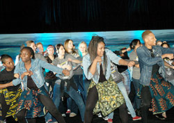 Members of the Global Children, African Dancers group from the archdiocese’s African Catholic Ministry lead other Catholic youths in a joyous beginning to the Indianapolis Catholic Youth Conference on Nov. 2 at Marian University in Indianapolis. (Photo by John Shaughnessy)