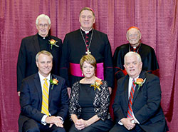 An archdiocesan celebration of Catholic education on Nov. 5 honored four individuals whose Catholic values mark their lives. Sitting, from left, are honorees Daniel Elsener, Beth Elsener and Robert Desautels. Standing, from left, are honoree Father James Wilmoth, Archbishop Joseph W. Tobin and keynote speaker Cardinal Theodore E. McCarrick, archbishop emeritus of Washington. (Photo by Rob Banayote)