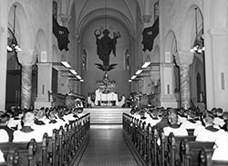 Seminarians worship together at a Mass in 1965 at the Archabbey Church of Our Lady of Einsiedeln in St. Meinrad. The liturgical renewals called for by the Second Vatican Council had begun to be implemented months earlier. The liturgical formation that seminarians have received at Saint Meinrad Seminary and School of Theology over the past half century have greatly affected the renewal of the liturgy in the Church in central and southern Indiana. (Photo courtesy of Saint Meinrad Archives)