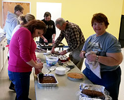 Volunteers help prepare desserts on Nov. 27 at St. Lawrence School in Lawrenceburg for a Thanksgiving meal for people in need in southeastern Indiana. The dinner was sponsored by Knights of Columbus Council 1231 in Lawrenceburg, and was aided by many members of St. Lawrence Parish and volunteers from the broader community. (Submitted photo)