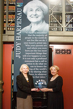 In this Oct. 23, 2014 photo, Cathy Krieger, left, CEO of Children’s Place International and The Children’s Place Association, presents an award to Judy Harpenau, a member of St. Bartholomew Parish in Columbus. (Submitted photo)