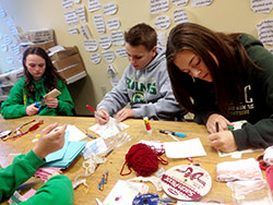 As part of a Joseph Maley Foundation Service Day activity, Holy Spirit students make Christmas cards on Nov. 13, 2014, for members and families of Down Syndrome Indiana. (Submitted photo)