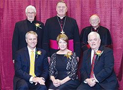 An archdiocesan celebration of Catholic education on Nov. 5 honored four individuals whose Catholic values mark their lives. Sitting, from left, are honorees Daniel Elsener, Beth Elsener and Robert Desautels. Standing, from left, are honoree Father James Wilmoth, Archbishop Joseph W. Tobin and keynote speaker Cardinal Theodore E. McCarrick, archbishop emeritus of Washington. (Photo by Rob Banayote)