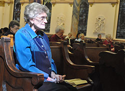 Providence Sister Marcelline Mattingly sits in prayer during a March 5 Mass at the Church of the Immaculate Conception on the motherhouse grounds of the Sisters of Providence of Saint Mary-of-the-Woods in St. Mary-of-the-Woods. (Photo by Sean Gallagher)