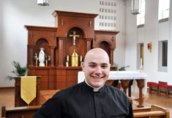 Deacon Adam Ahern is all smiles as he gives a tour through the chapel at Bishop Simon Bruté College Seminary in Indianapolis, the setting where he first had the opportunity to test his call to the priesthood. (Photo by John Shaughnessy)	