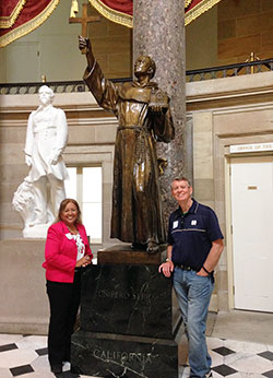 Maria Pimentel-Gannon  and her husband Jack Gannon stand in the U.S. Capitol’s Statuary Hall next to a statue of St. Junipero Serra, who was canonized by Pope Francis on Sept. 23 in Washington.  Maria attended Pope Francis’ address to Congress on Sept. 24. (Submitted photo)