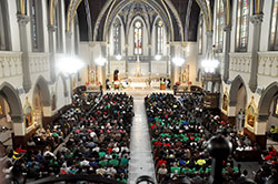 More than 1,000 youths, youth ministry leaders and chaperones from the archdiocese packed St. John the Evangelist Church in Indianapolis on Nov. 19 for a Mass celebrated by Archbishop Joseph W. Tobin at the beginning of the National Catholic Youth Conference. (Photo by Natalie Hoefer)