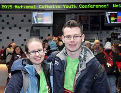 Siblings Andrea “Andie” and Luke Grant pose at Lucas Oil Stadium in Indianapolis on Nov. 21 after the NCYC closing Mass. The siblings, both past NCYC participants, returned this year as volunteers. (Photo by Natalie Hoefer)