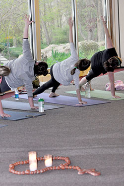 Women hold a position through the recitation of a Hail Mary while doing SoulCore—a rosary-based, core-strengthening exercise—at Our Lady of Fatima Retreat House in Indianapolis on April 29, 2015. (Criterion file photo by Natalie Hoefer)