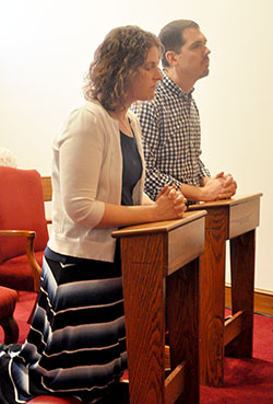 Julie and Matthew Miller pray on Jan. 30 in the perpetual adoration chapel at St. Luke the Evangelist Parish in Indianapolis, where the husband and wife are parishioners. The Millers head the Couple to Couple League of Indianapolis. (Photo by Natalie Hoefer)