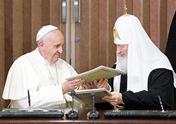 Pope Francis and Russian Orthodox Patriarch Kirill of Moscow exchange copies after signing a joint declaration during a meeting at Jose Marti International Airport in Havana on Feb. 12. (CNS photo/Paul Haring) 