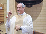 Deaf priest at Mass
