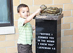 Child with memorial to the unborn