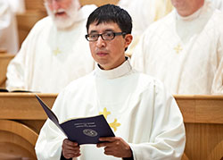 Transitional Deacon Nicolas Ajpacaja Tzoc wears a dalmatic after he was ordained a deacon during an ordination Mass at the Archabbey Church of Our Lady of Einsiedeln in St. Meinrad on April 11, 2015. (Photo courtesy of Saint Meinrad Archabbey)