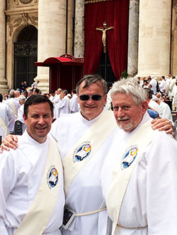 Archdiocesan deacons Ron Pirau, left, Brad Anderson and Michael East pose for a photo in St. Peter’s Square at the Vatican following the Mass for the Jubilee of Deacons that Pope Francis celebrated on May 29. (Submitted photo)