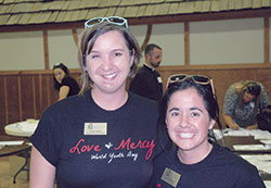 As leaders in the archdiocese’s Office of Young Adult and College Campus Ministry, Katie Sahm, left, and Krissy Vargo will lead more than 60 young adults on a pilgrimage to World Youth Day in Krakow, Poland, on July 25-31. (Photo by John Shaughnessy)