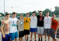 For Jack Lockrem, third from right, joining the cross country team at Bishop Chatard High School in Indianapolis led to a new challenge and a source of new friends. Here, he poses with fellow seniors on the team: Jackson Janowicz, left, John Hurley, Josef Eisgruber, Sam LeMark, Jacob deCastro, Daniel Burger and Rob Hofmann. (Photo by John Shaughnessy)