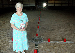For the “Holy Year of Mercy,” Mary Jean Wethington created a 40-foot wooden cross inside the barn of her 18-acre farm in Dearborn County. Wethington formed the cross from pieces of wood that are “broken, cracked and splintered”—a description, she says, that symbolizes parts of many people’s lives, including her relationship with her biological father. (Photo by John Shaughnessy)